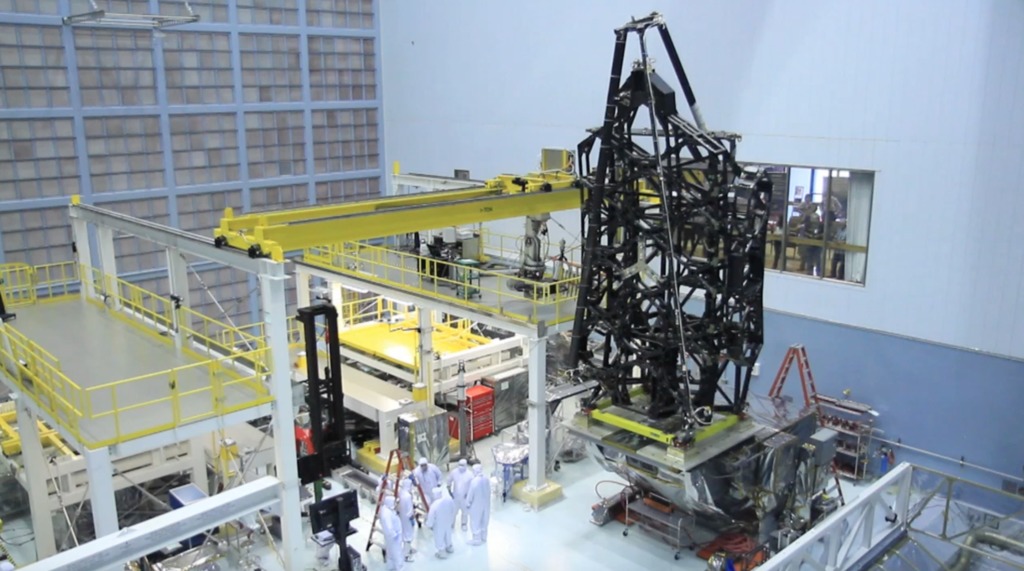 JWST flight structure is moved to a vertical position on a tiltable platform in the cleanroom at GSFC