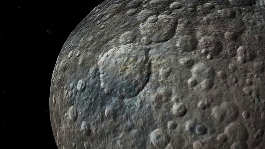 LEAD: A colorful new animation shows a simulated flight over the surface of dwarf planet Ceres, based on images from NASA's Dawn spacecraft.1. The movie shows Ceres in enhanced color, which helps to highlight subtle differences in the appearance of surface materials. Scientists believe areas with shades of blue contain younger, fresher material, including flows, pits and cracks.TAG: Ceres is the largest body in the main asteroid belt between Mars and Jupiter. It has a diameter of about 590 miles and is made up of ice and rock. 