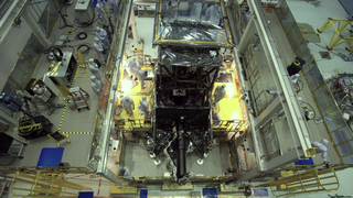 Time lapse video of two dozen engineers and technicians successfully installing the package of science instruments of the James Webb Space Telescope into the telescope structure. The package, known as the Integrated Science Instrument Module or ISIM, is the collection of cameras, spectrographs and fine guidance systems that help record the light collected by Webb’s giant golden mirror.

Inside the world’s largest clean room at NASA’s Goddard Space Flight Center in Greenbelt, Maryland, the team crane-lifted the heavy science instrument package, lowered it into an enclosure on the back of the telescope, and secured it to the telescope.

The entire installation process took approximately 17 hours to complete.