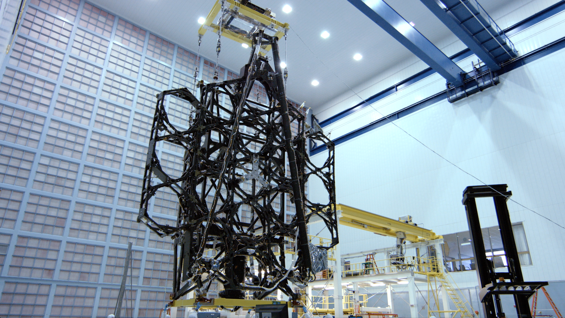 4K B-roll footage of the Webb Telescope's first flight mirror being installed onto the backplane at GSFC.  