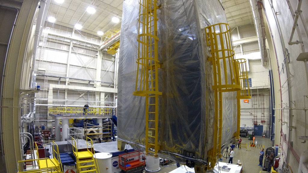 Timelapse of Webb covered in a clean tent being moved from the cleanroom and lifted onto a vibation testing table at Goddard Space Flight Center.