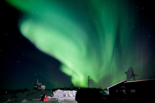 The Northern & Southern lights, created by the interaction of charged particles carried by the solar wind and Earth's magnetosphere with the atmosphere.