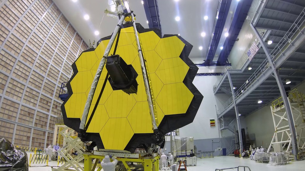 Time lapse of engineers in NASA Goddard Sapce Flight Center cleanroom folding and placing the James Webb Space Telescope optical and instrument element into its shipping container called the Space Telescope Tranporter Air Road and Sea (STTARS) container.  