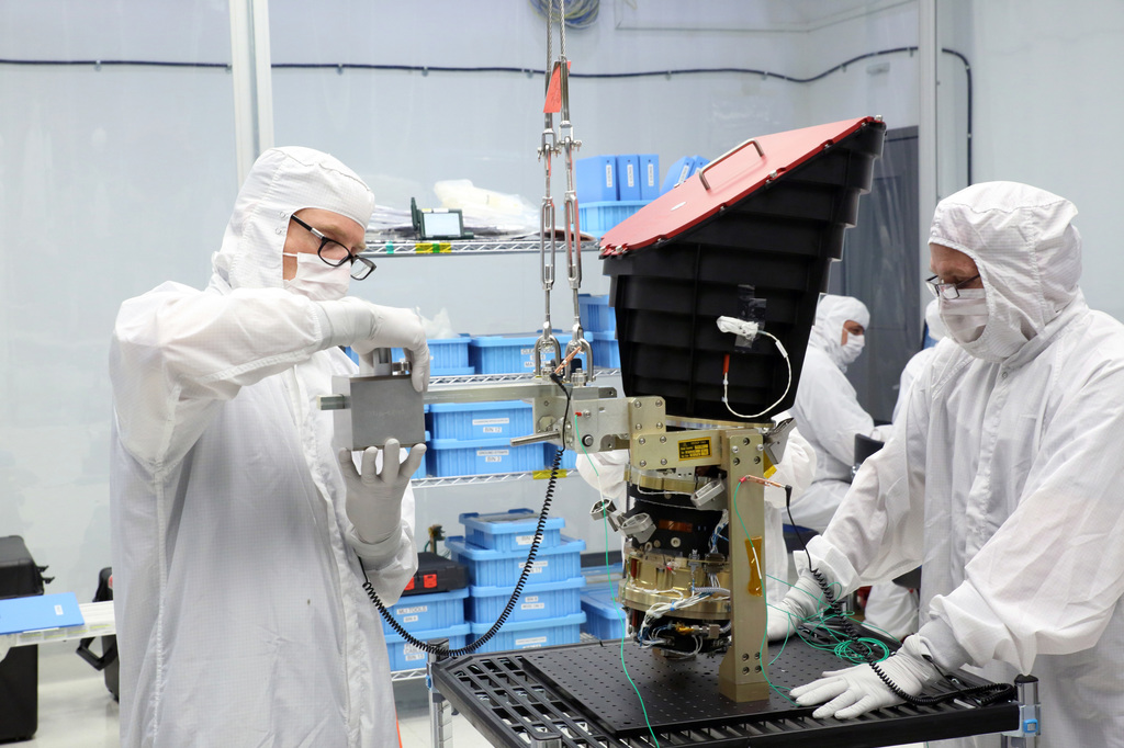 TESS cameras being mounted onto the camera plate at Orbital ATK in Dulles, Va. prior to installation onto spacecraft.