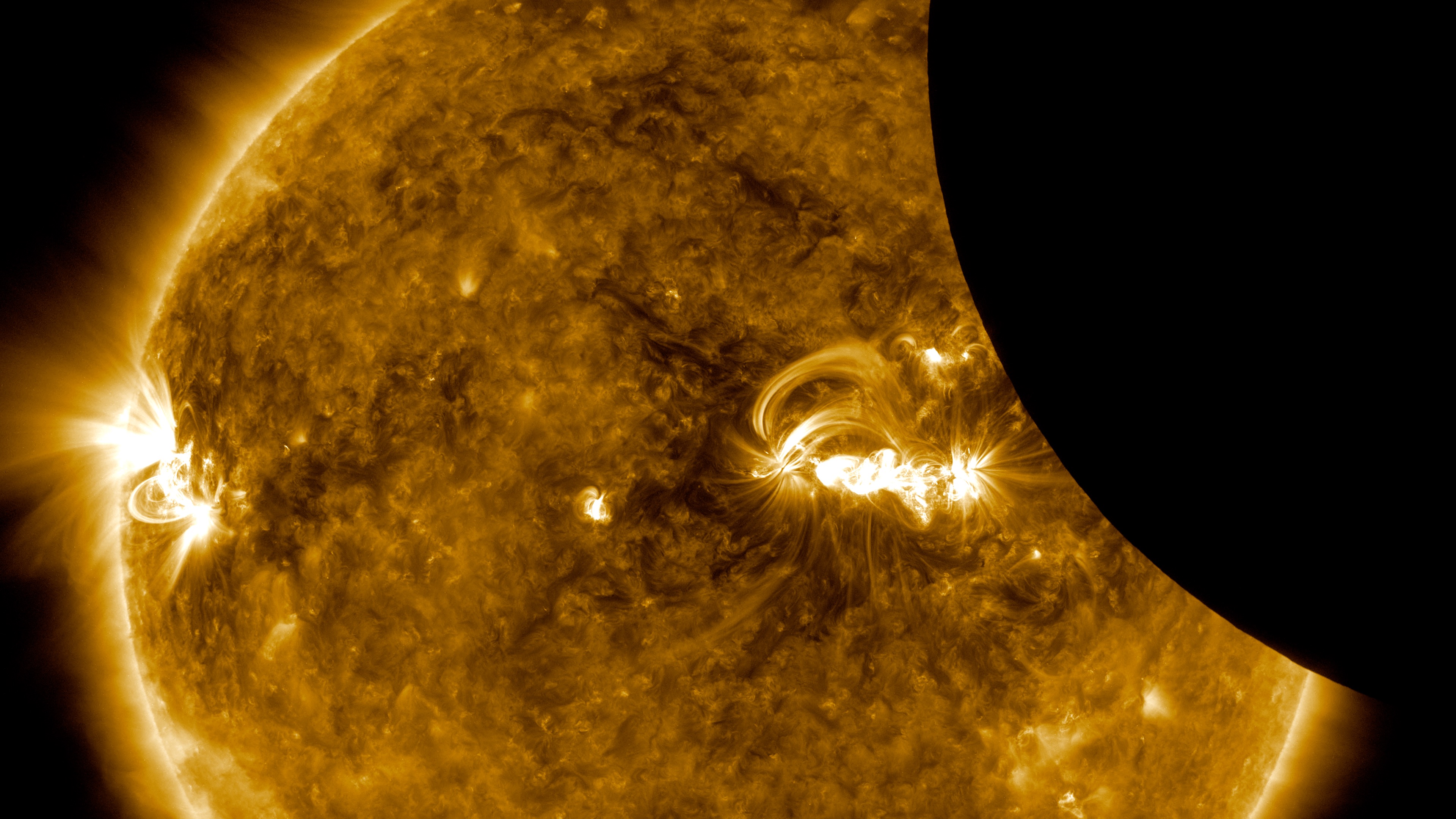 A movie of the Aug 21, 2017 lunar transit as viewed by the Solar Dynamics Observatory (SDO.) The Sun appears in visible light, and 171 &aring;ngstrom extreme ultraviolet light. The movie shows the Sun moving a bit because SDO has a hard time keeping the Sun centered in the image during a transit, because the Moon blocks so much light. The fine guidance systems on the SDO instruments need to see the whole Sun in order keep the images centered from exposure to exposure. Once the transit was over, the fine guidance systems started back up, once again providing steady images of the Sun.Credit: NASA/SDOWatch this video on the NASA Goddard YouTube channel.
