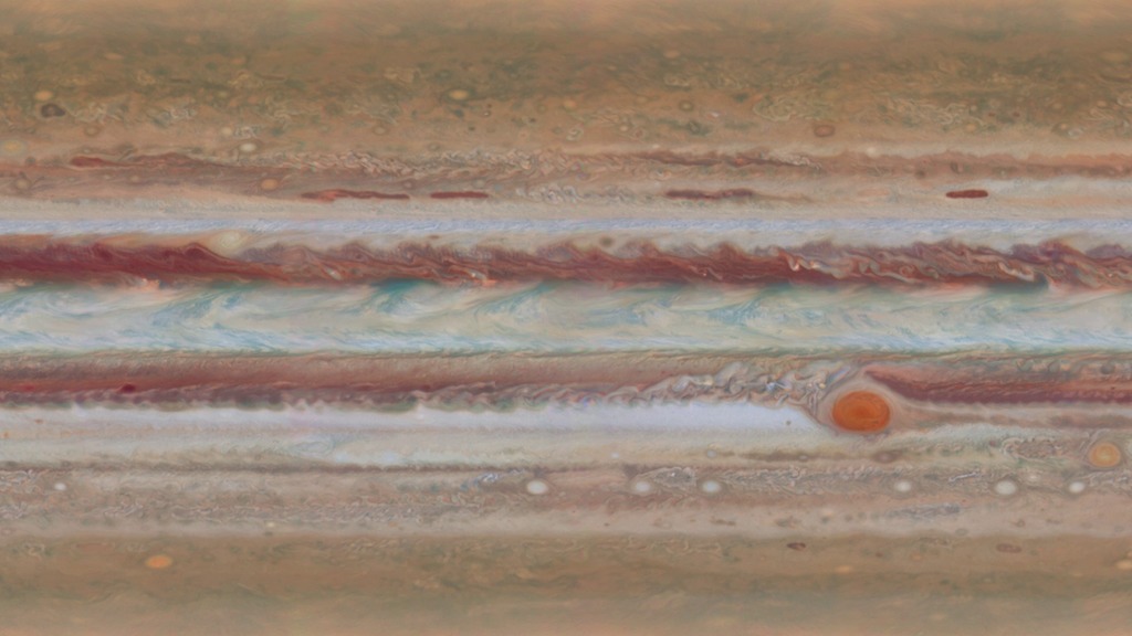 The movement of Jupiter’s clouds can be seen when comparing these two global maps, in which Jupiter’s cloud bands are laid out as a flat projection. Scientists produced these maps of Jupiter using Hubble Space Telescope observations for the Outer Planet Atmospheres Legacy program taken on January 19, 2015, from 2:00 UT to 12:30 UT and from 15:00 UT to 23:40 UT. In Jupiter’s North Equatorial Belt, Hubble imaged an elusive wave that had been spotted on the planet only once before, decades earlier, by Voyager 2. In Voyager’s images, the wave is barely visible, and nothing like it was seen again until the recent Hubble observations. In the Hubble images, the wave appears as nearly vertical lines passing through the top of the dark, central cloud belt. The wave was found traveling in a region dotted with cyclones and anticyclones. Similar waves—called baroclinic waves—sometimes appear in Earth’s atmosphere where cyclones are forming. The wave may originate in a clear layer beneath the clouds, only becoming visible when it propagates up into the cloud deck.