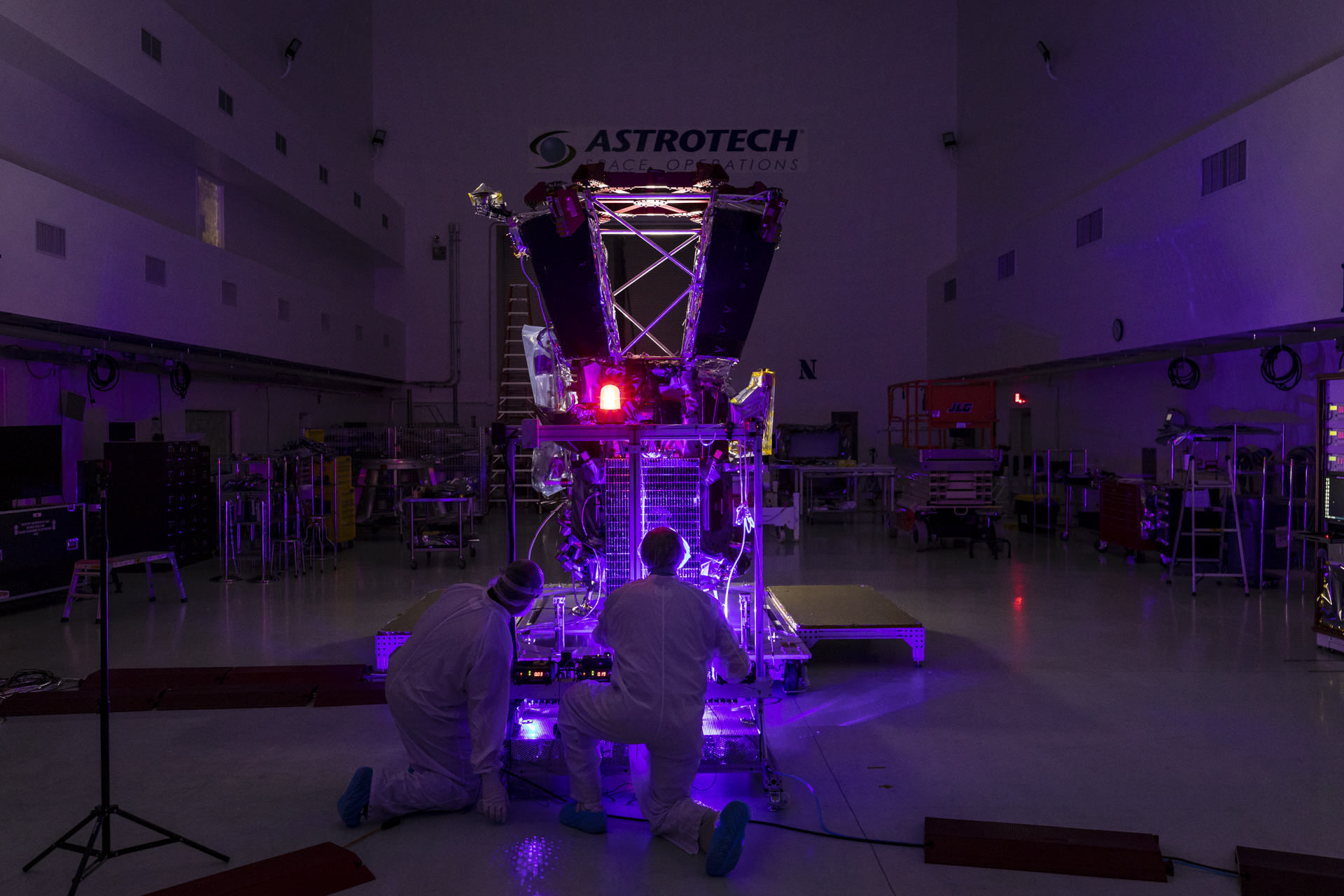 After installation of the solar arrays on May 31, 2018, Parker Solar Probe team members use a laser to illuminate the solar cells and verify that they can create electricity and transfer it to the spacecraft.Credit: NASA/Johns Hopkins APL/Ed Whitman