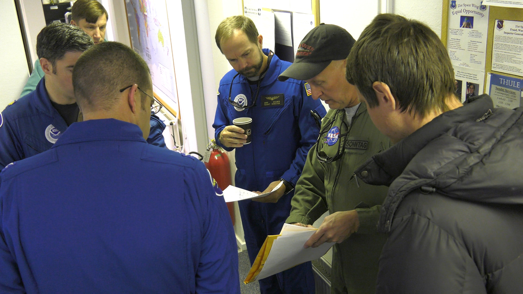 IceBridge Mission Scientist, John Sonntag, discusses upcoming flight plans with the NOAA crew. 