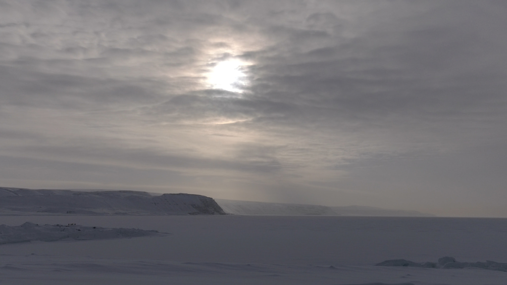 B-roll of clouds moving over fjord and open sea ice. Filmed during the 2017 Arctic campaign. 
