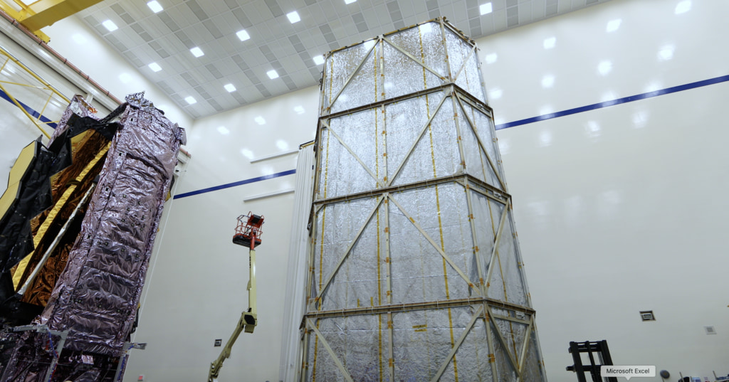 B-Roll footage of engineers installing the +J2 side of the clamshell tent cover around the James Webb Space Telescope at Northrop Grumman in Redondo Beach, CA.