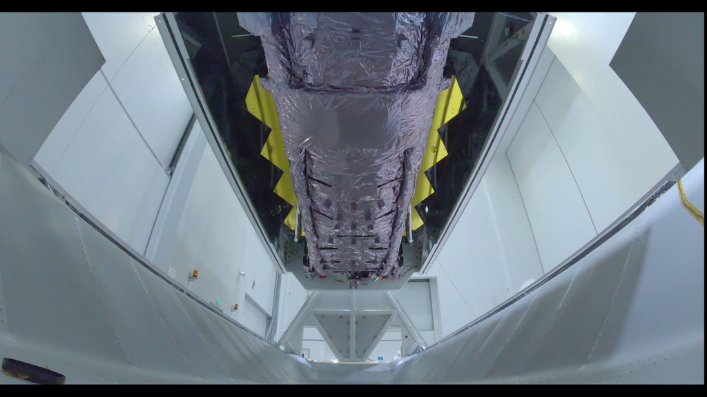 Time lapse of the Webb Telescope being lifted out of its special shipping container.  This footage inlcudes a view from inside the shipping container.