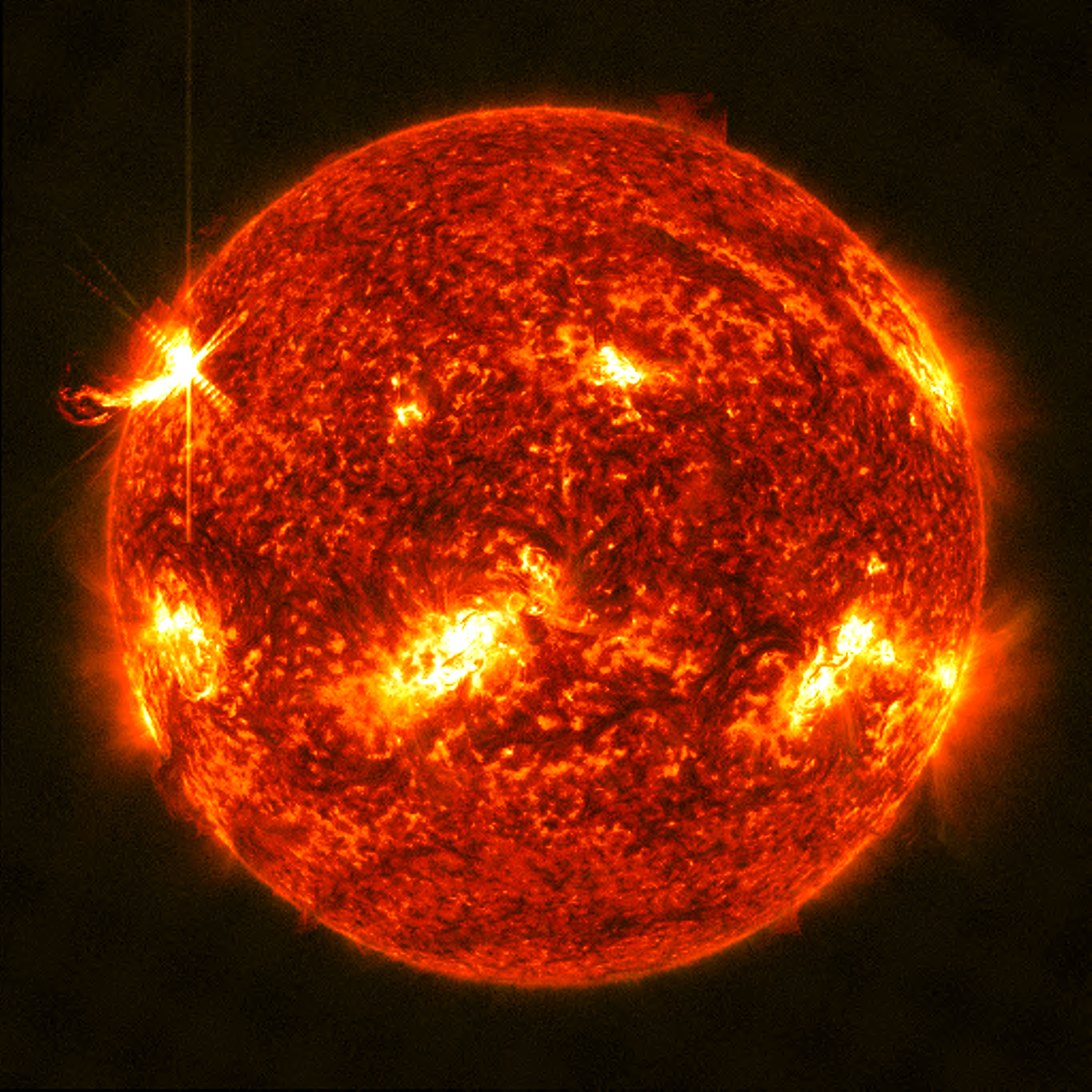 An X1.0 class solar flare flashes on the left edge of the Sun on January 10, 2023. This image was captured by NASA's Solar Dynamics Observatory and shows a blend of light from the 304 and 131 angstrom wavelengths.Credit: NASA/GSFC/SDO