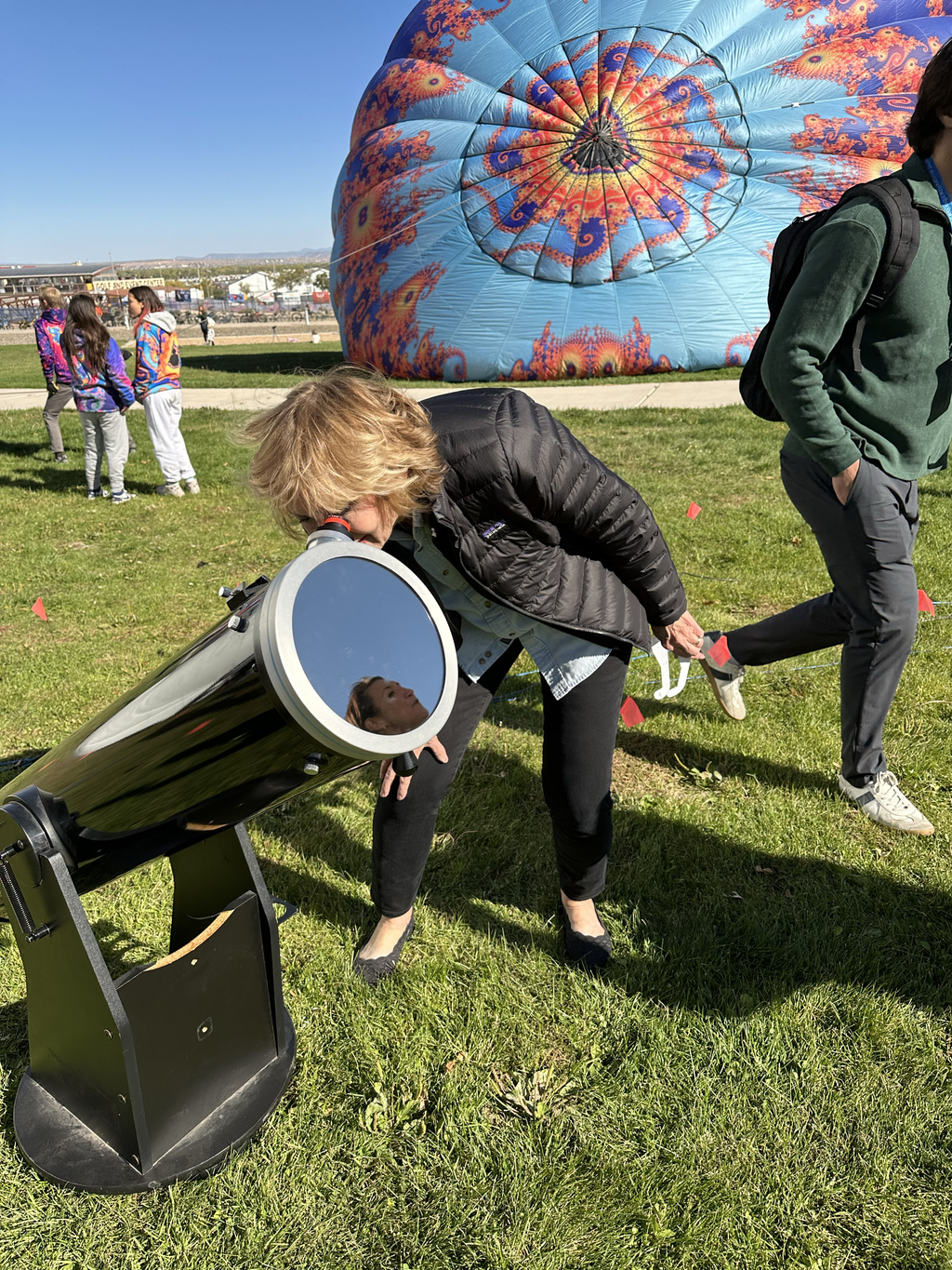 Watching the annular solar eclipse of October 14, 2023, in Albuquerque, New Mexico, through a solar safe telescope. Binoculars and telescopes can ONLY be used to look at the Sun or watch an eclipse when used with solar filters specially designed for that purpose. Wearing solar viewing glasses will not protect your eyes when used with binoculars or telescopes – you must have an appropriate filter.Image Cedit: NASA