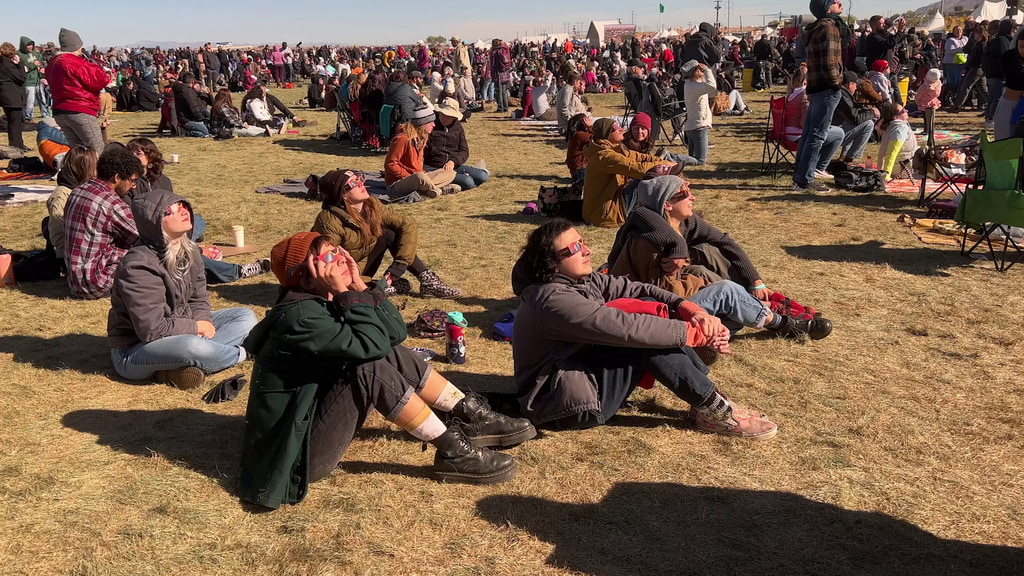 B-roll footage of attendees at the Albuquerque International Balloon Fiesta in Albuquerque, New Mexico, wearing safe solar glasses to observe the annular solar eclipse of October 14, 2023.Video Credit: NASA/Jefferson Beck