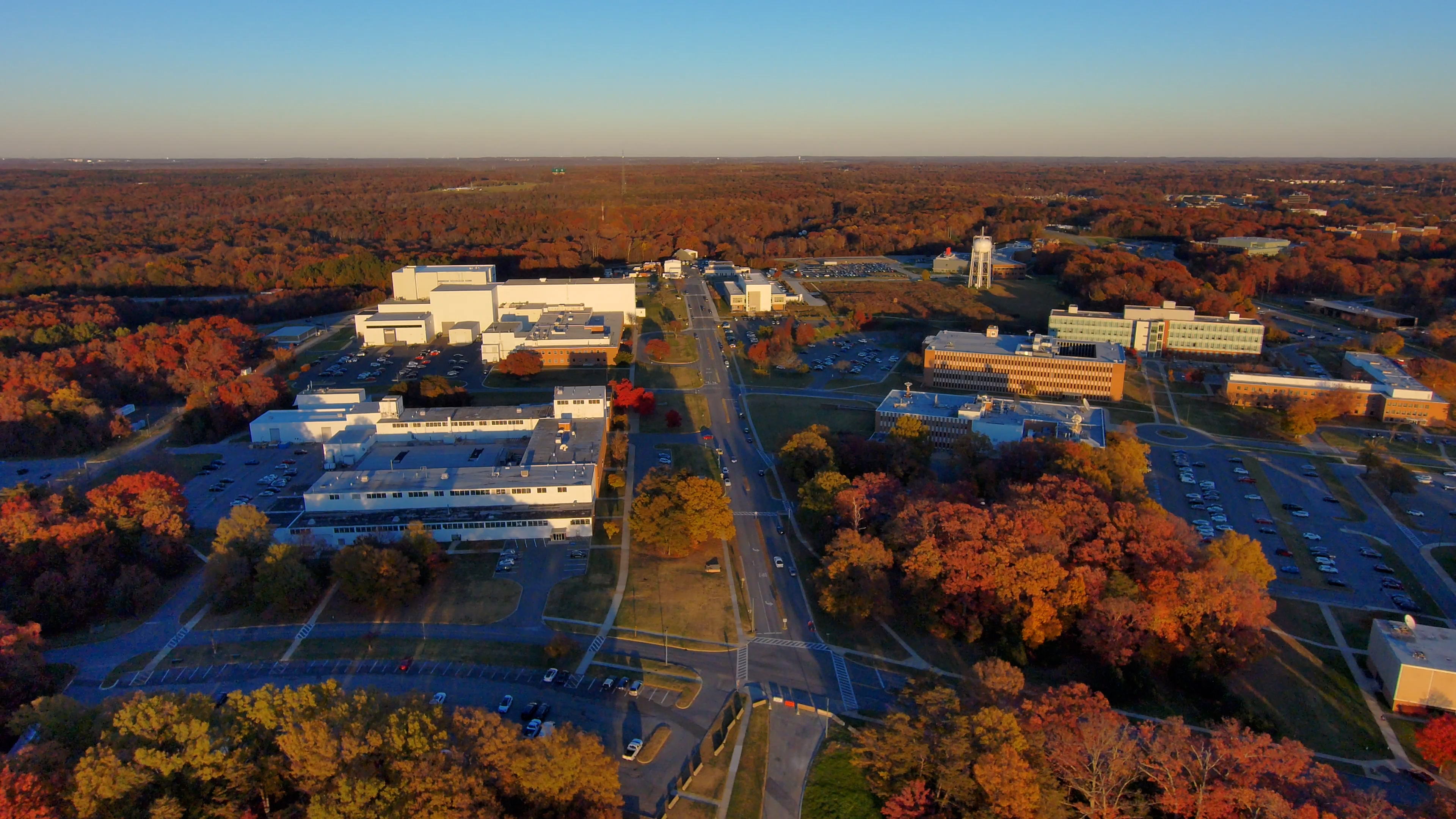 Views of the Goddard campus, from various heights, looking northeast from above Building 21, with fall colors in the late afternoon and magic hour. Several shots rise from below the tree line. Others fly forward or backward, looking toward the Integration & Testing Facility prominent in the background.Credit: NASA/Francis Reddy