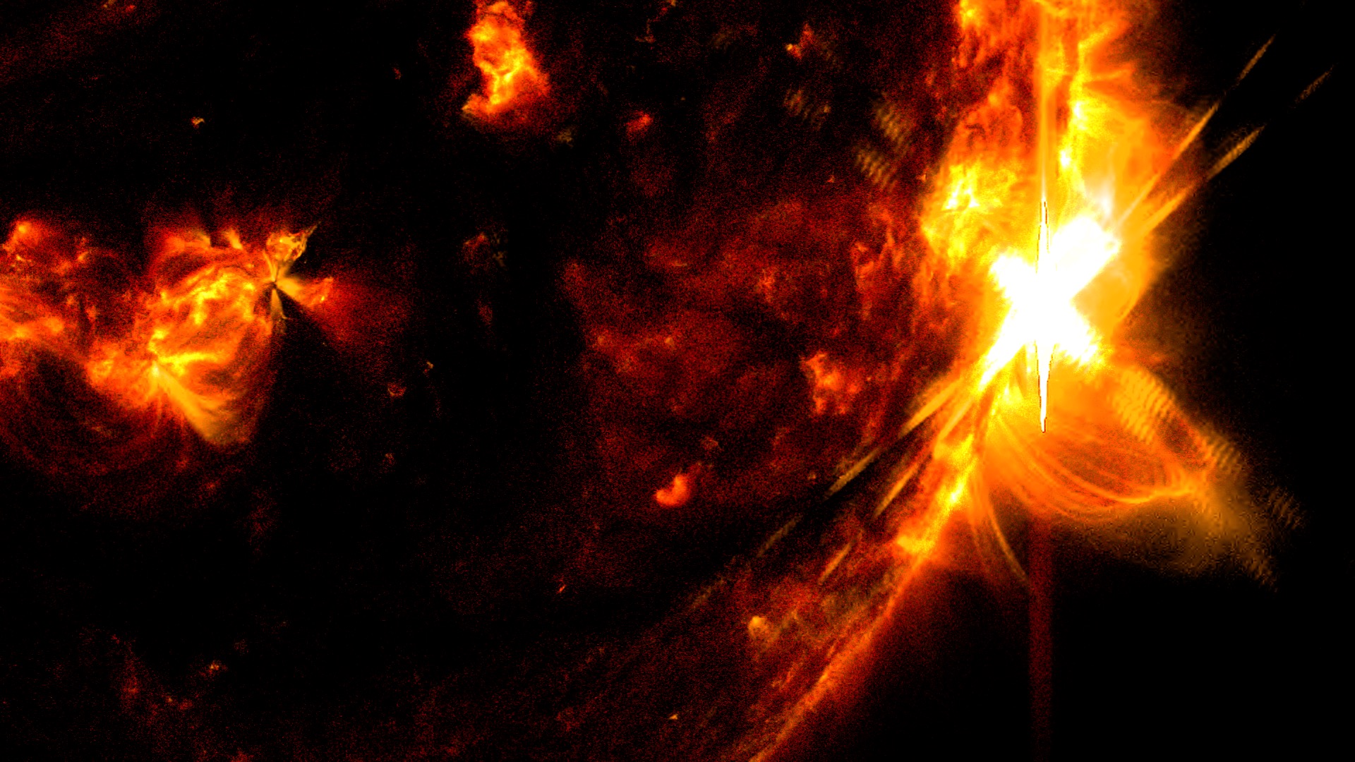 NASA’s Solar Dynamics Observatory captured this image of a solar flare – as seen in the bright flash on the right – on May 14, 2024. The image shows a subset of extreme ultraviolet light that highlights the extremely hot material in flares and which is colorized in red and yellow. Credit: NASA/SDO