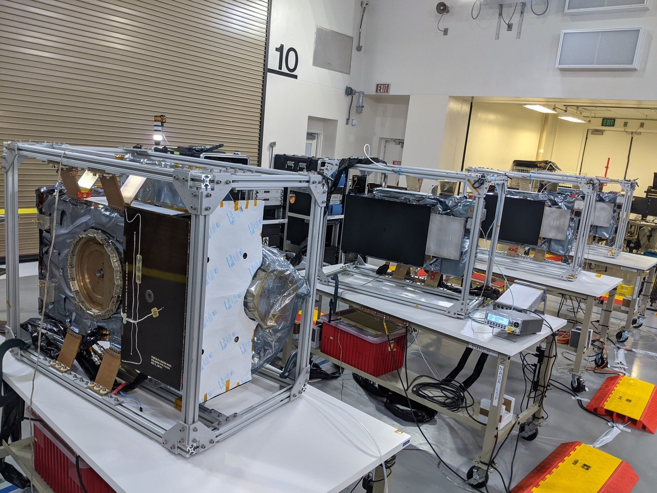 Technicians conduct integration and testing of NASA’s PUNCH (Polarimeter to Unify the Corona and Heliosphere) satellites during prelaunch operations inside Astrotech Space Operations on Vandenberg Space Force Base in California on Thursday, Jan. 23, 2025.Credit: Southwest Research Institute (SwRI)