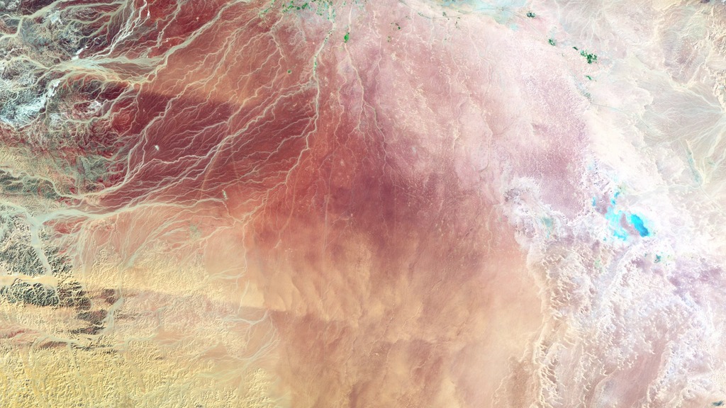 This series of false-color satellite images show the evolution of agricultural operations in the Wadi As-Sirhan Basin.