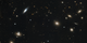 A region of the Coma cluster of galaxies showcases a variety of galaxy shapes and sizes.