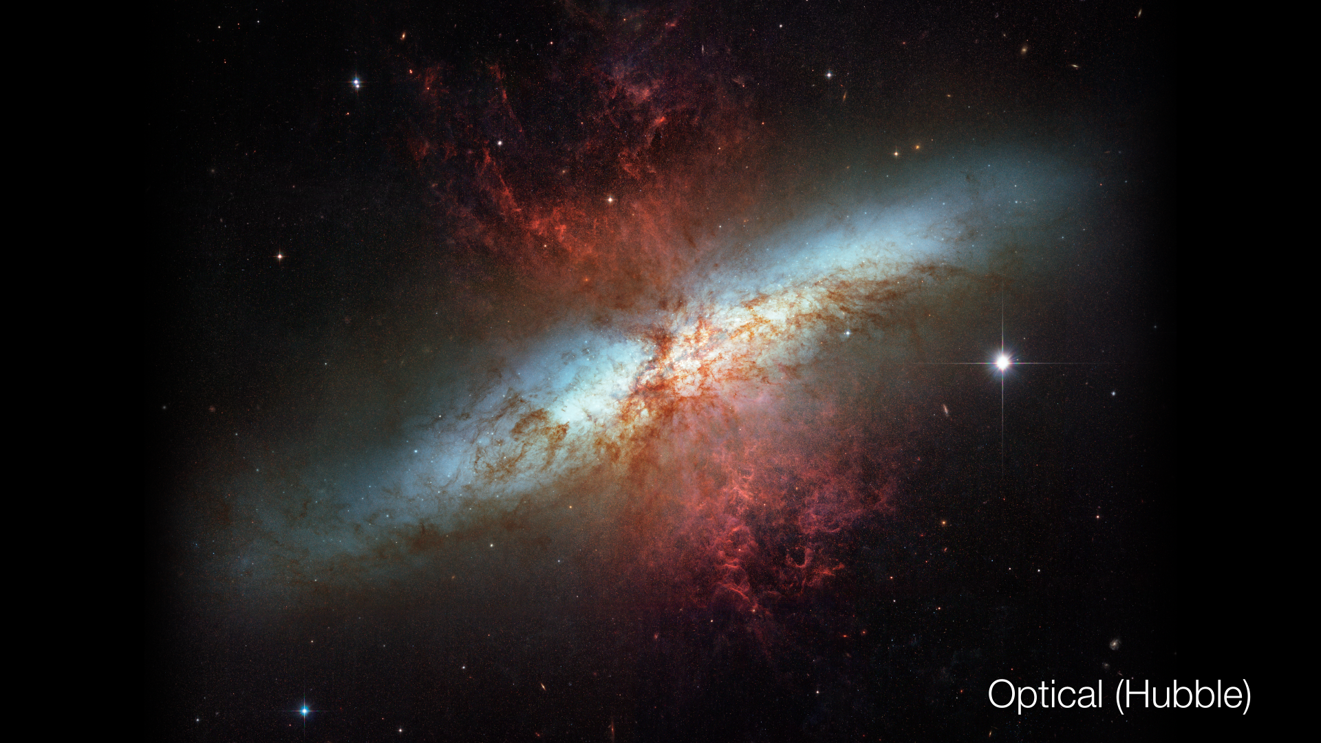 Hubble optical image of Messier 82In visible light the edge-on disk highlights the geysers of hot gas shooting out of M82's core.